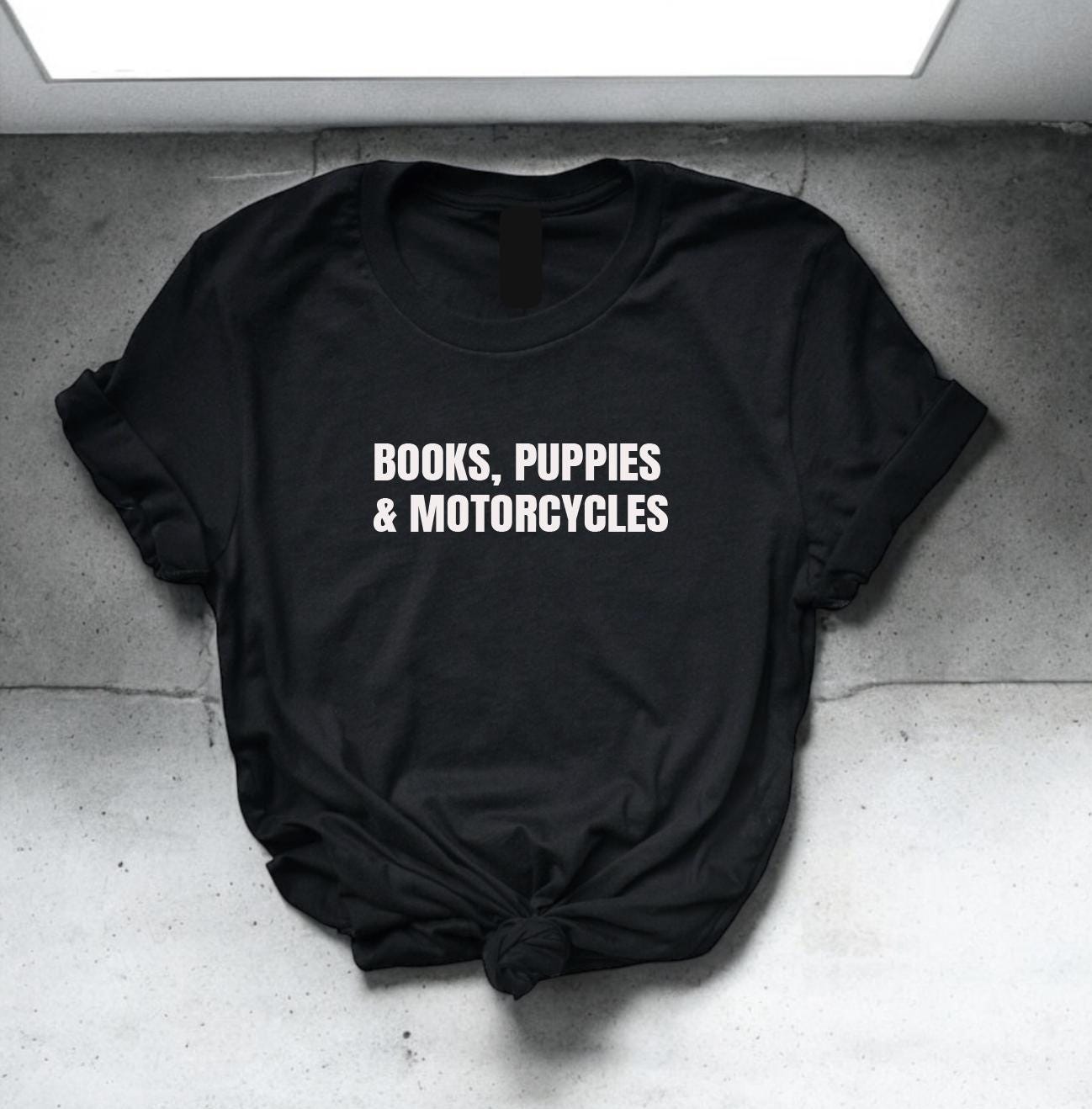 T-shirt with a fun design for book lovers, dog fans, and motorcycle enthusiasts—ideal for adventurous multitaskers.