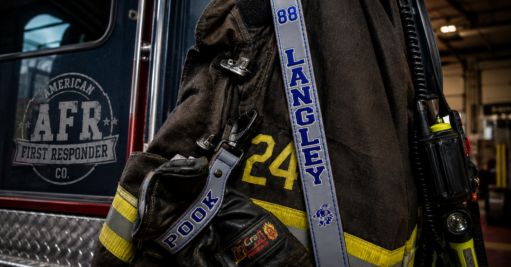 Custom leather firefighter radio strap personalized with blue lettering and radio holster on turnout gear