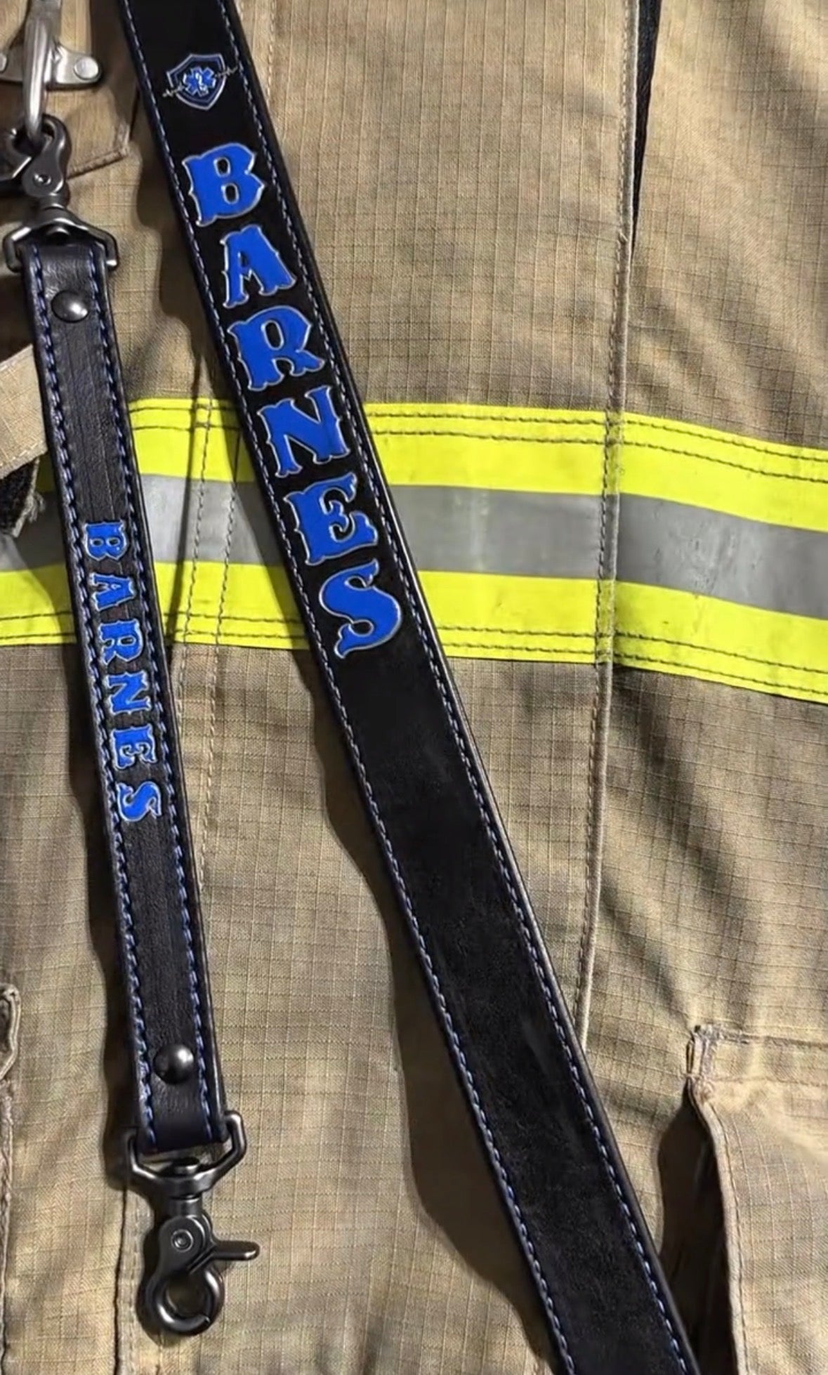 Handcrafted leather firefighter radio strap with blue personalized lettering
