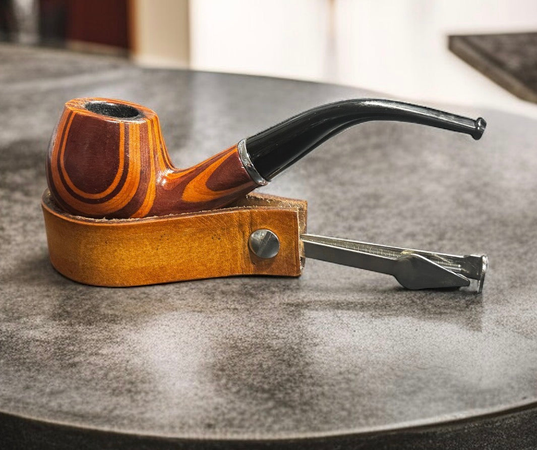 Handcrafted leather pipe holder with 3-in-1 tamper tool in English Bridle dye, pipe resting in holder