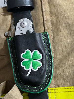 Black leather Raptor Shears holster with green shamrock design