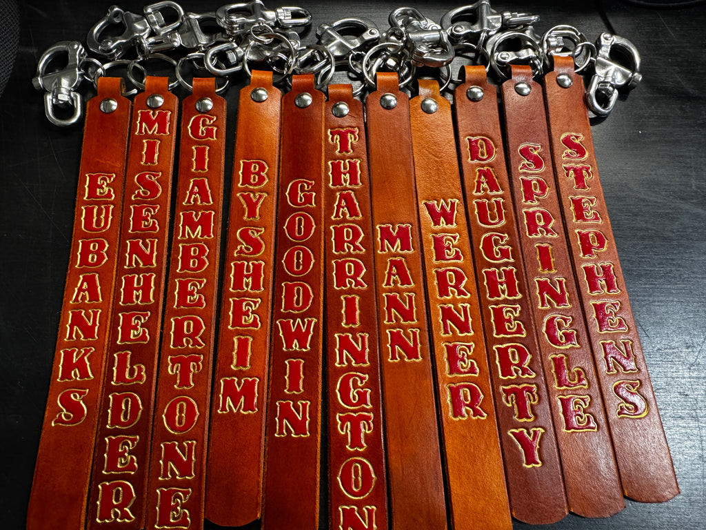 Heavy-duty swivel snap hardware attached to extra-long custom leather SCBA quick release pulls.
