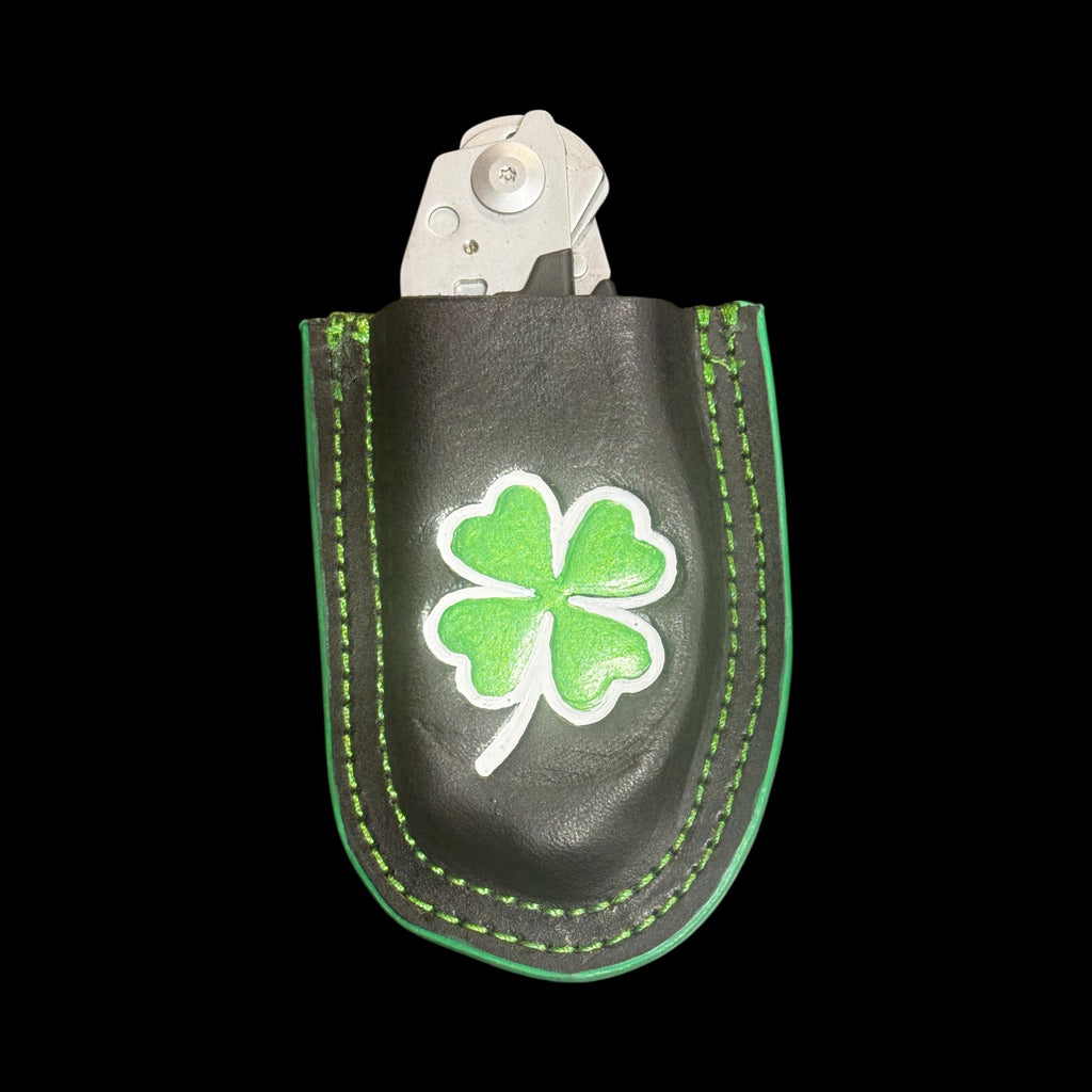 Shamrock Raptor Shears holder attached to a firefighter radio strap on turnout gear