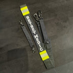 Personalized firefighter radio strap with silver reflective name, matching reflective trim, heavy-duty hardware, and webbing anti-sway strap by American First Responder Co.