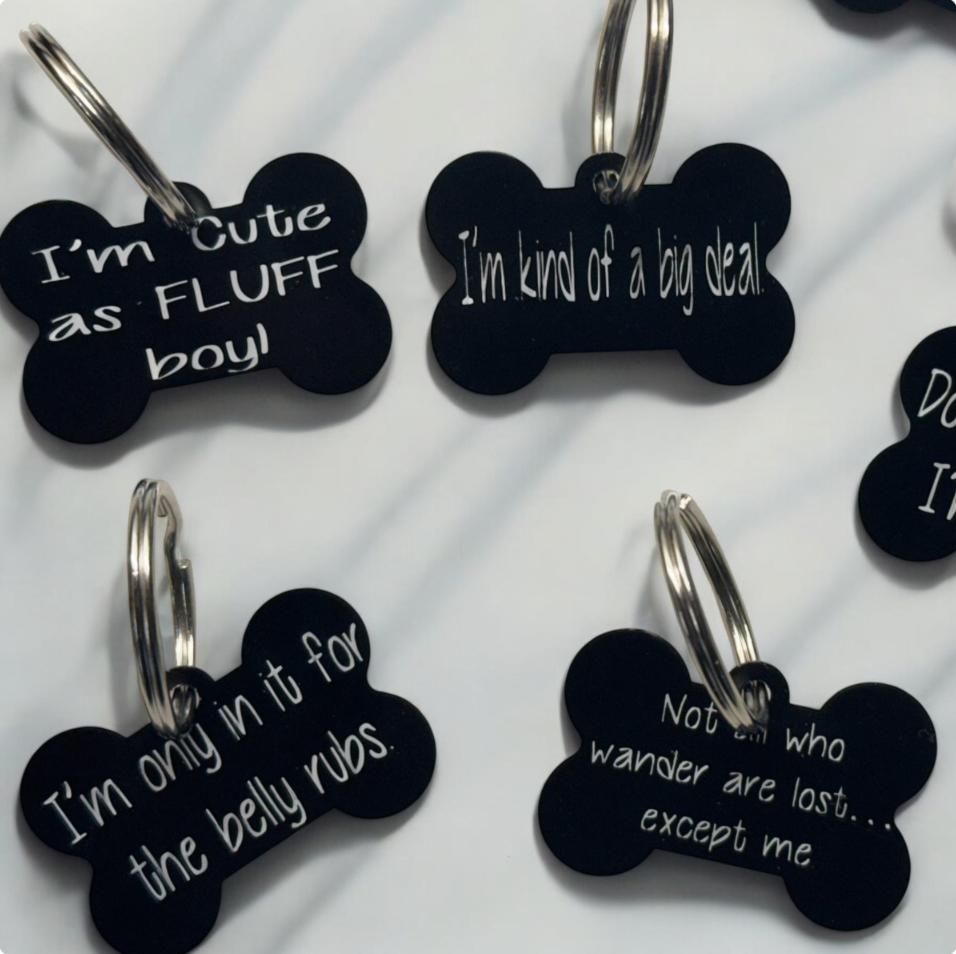 Small bone-shaped dog tag engraved with sarcastic phrase