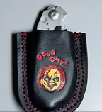 Black leather sheath with red stitching featuring a character design and 'Good Guys' text on a gray background