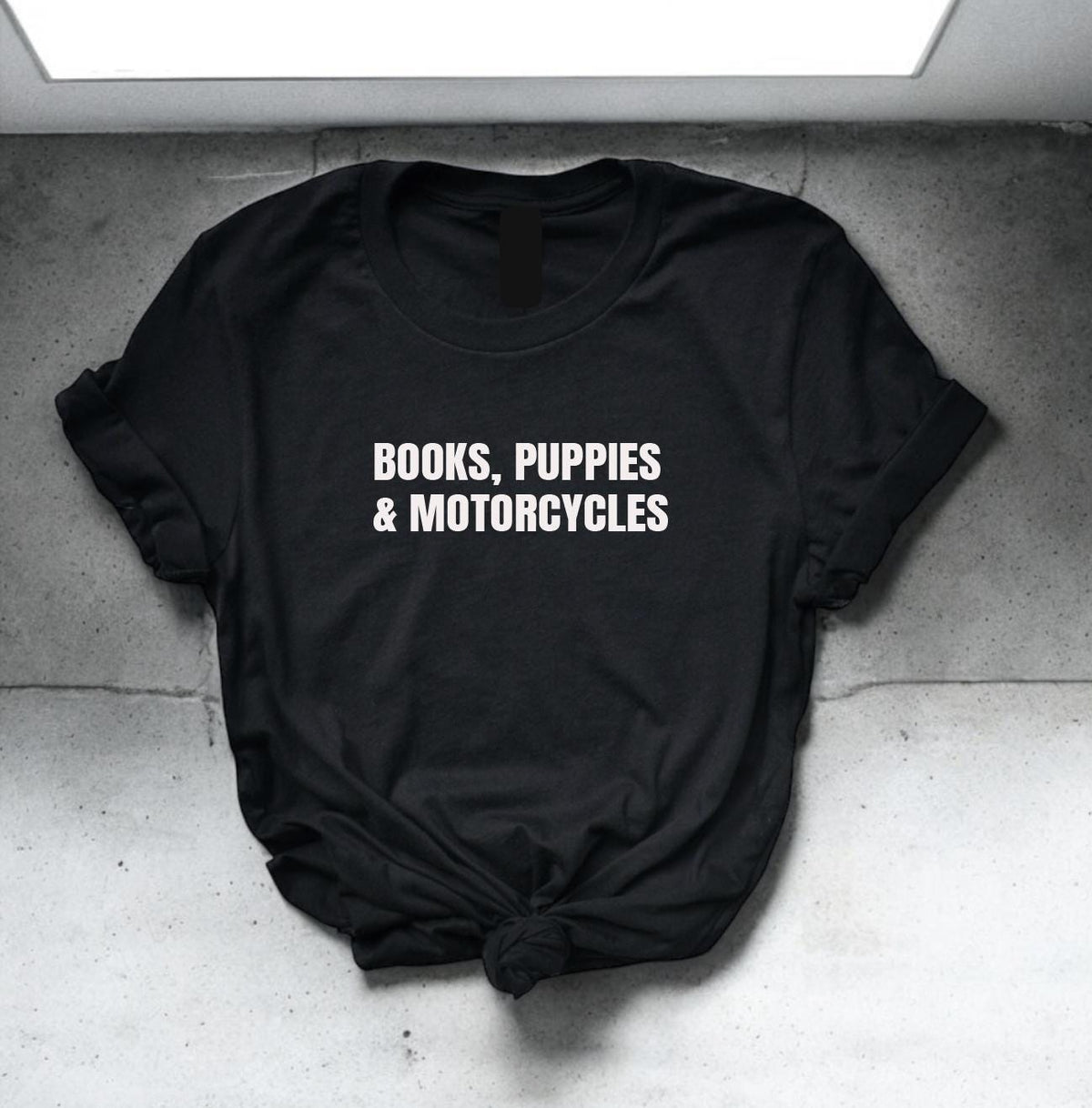 T-shirt with a fun design for book lovers, dog fans, and motorcycle enthusiasts—ideal for adventurous multitaskers.