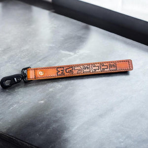 Personalized leather glove strap with stamped firefighter name