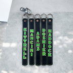 Custom glow-in-the-dark leather SCBA quick release pulls with heavy-duty swivel snap and key ring hardware for firefighter turnout gear.