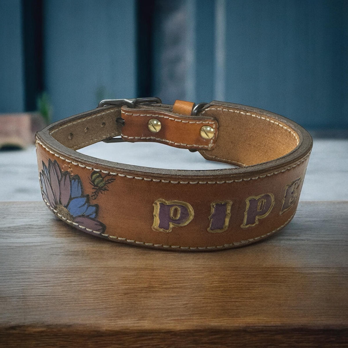 Handcrafted leather dog collar featuring handpainted personalized name