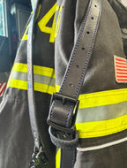 Black leather firefighter radio strap with radio holster attached